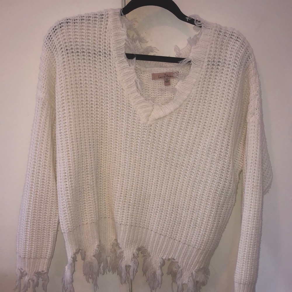 White v-neck sweater with distressed detail